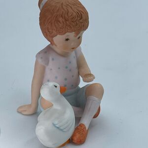 Vintage “Perfect Pals” ceramic figurine little girl and a duck.